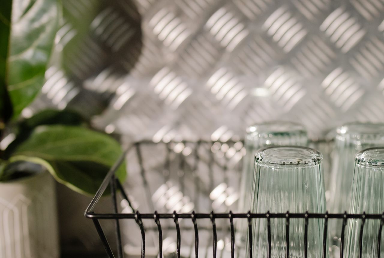 Sparkling, spot-free dishes and glasses drying after a wash in soft water