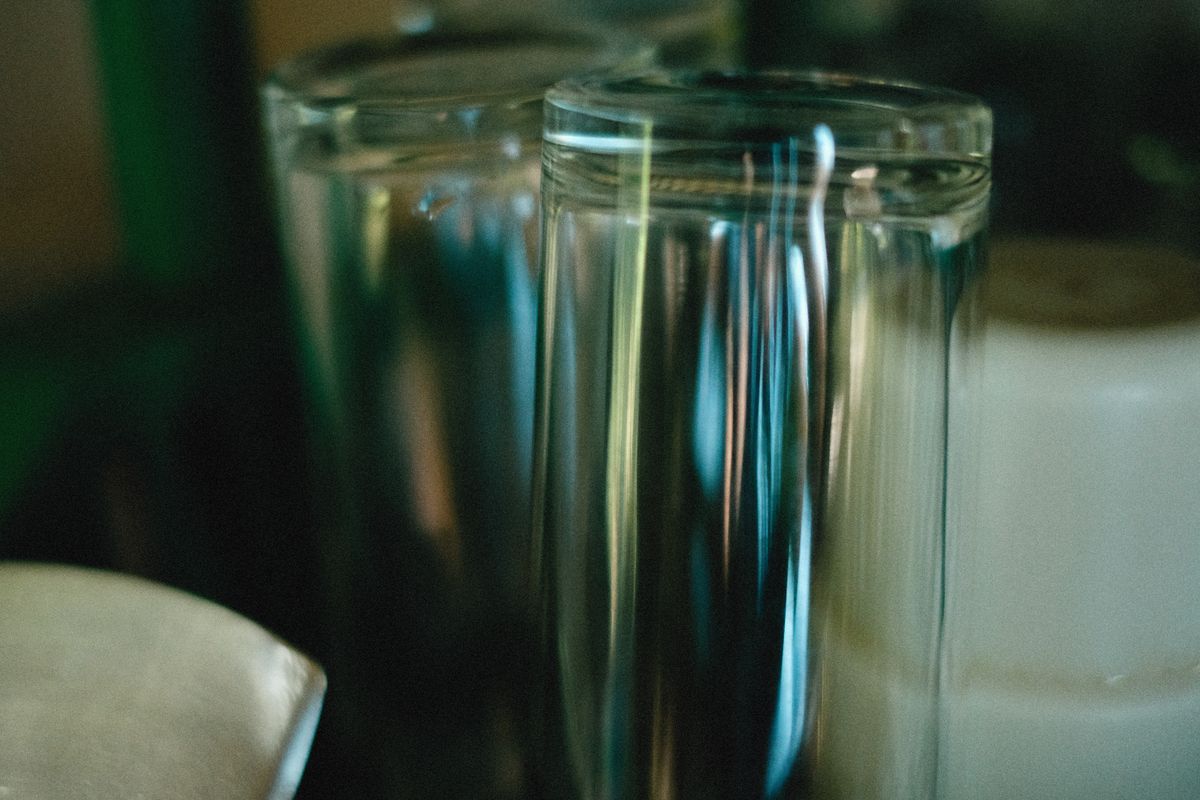 Close-up of a glass of clear, odor-free drinking water with no rotten egg smell