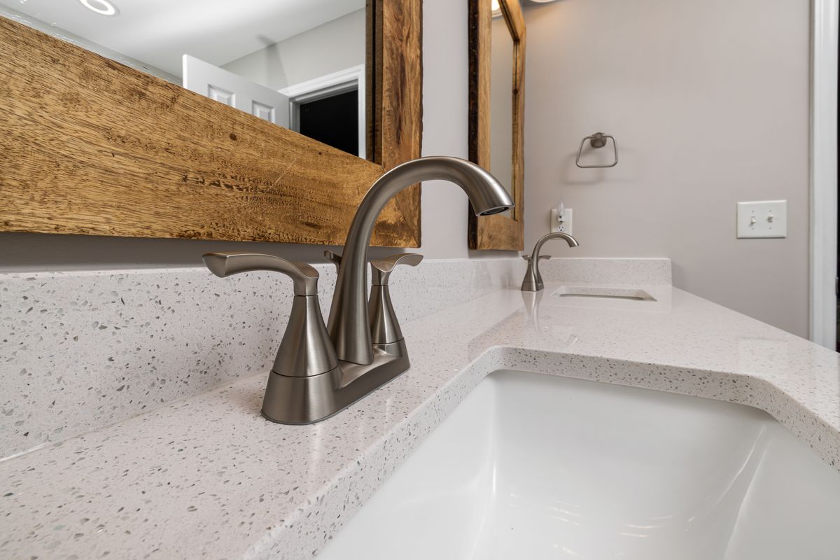 Dual sink faucets running clear, treated water in a North Florida home