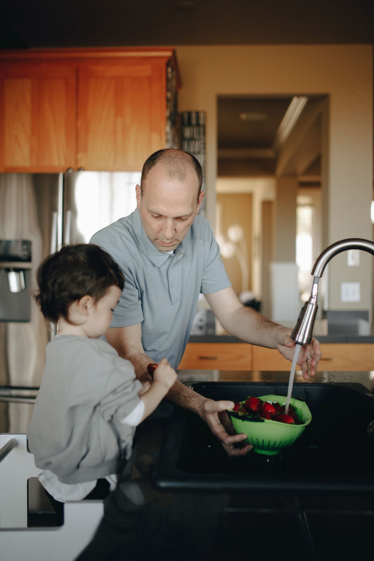 A father and child drinking crystal-clear treated water together