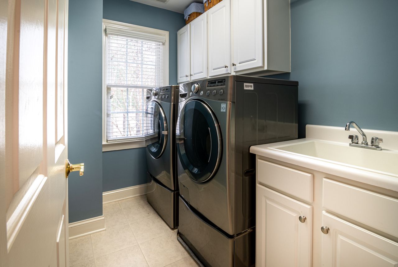 Washer and dryer in a home laundry room — soft water helps water-using appliances last up to 30% longer
