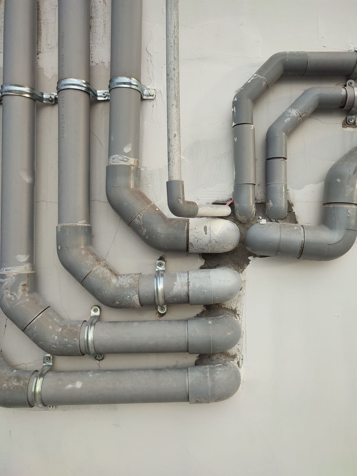 Metal supply pipes carrying treated water through a Jacksonville home with a whole-home treatment system