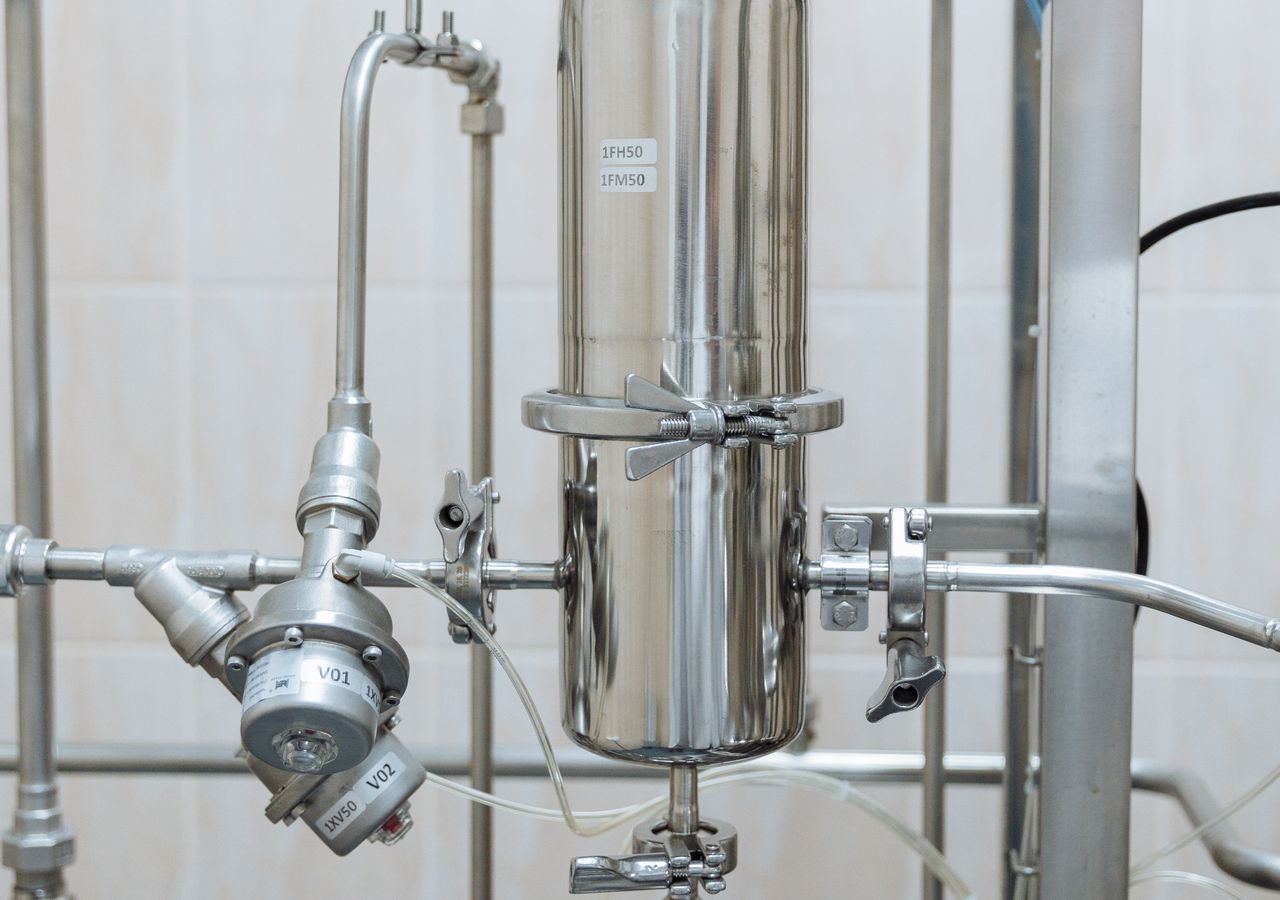Stainless-steel whole-home water treatment system with control valves, like the commercial-grade Kenai ProElite